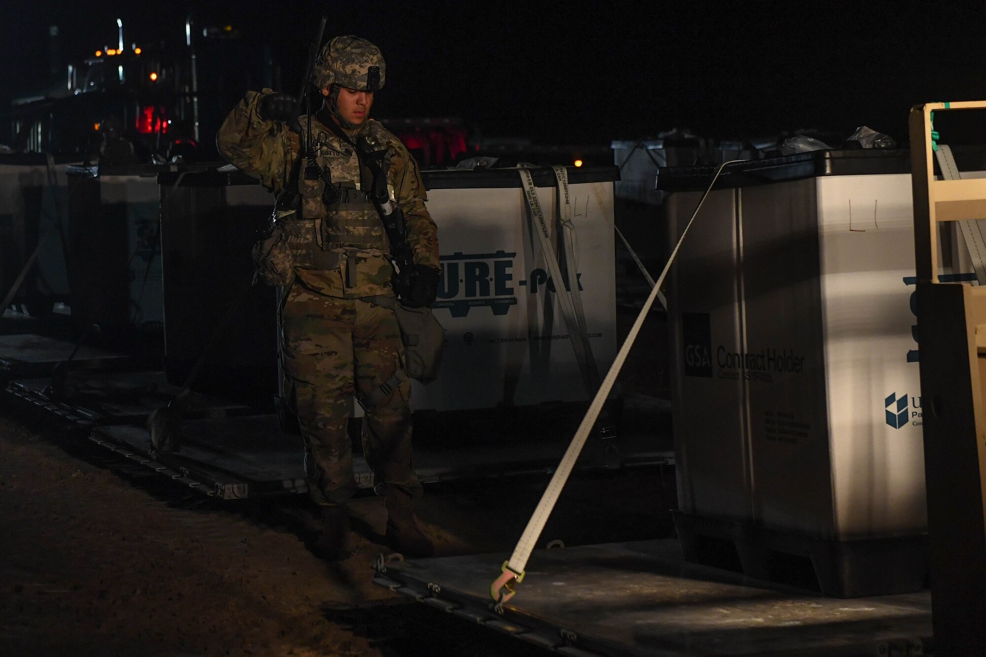 U.S. Army Sgt. Jose Cotto, 689th Rapid Port Opening Element, 832nd Transportation Battalion, 597th Transportation Brigade cargo specialist, directs the lowering of a cargo pallet during Exercise Turbo Distribution 18-02 at Fort McCoy, Wisconsin, Sept. 10, 2018. Exercise Turbo Distribution 18-02 was a seven-day exercise which included 24-hour operations of constant inbound cargo shipments. (U.S. Air Force photo by Senior Airman Derek Seifert)