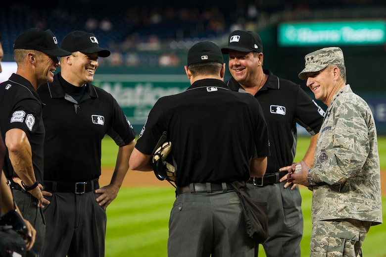 The General talks with baseball officials.