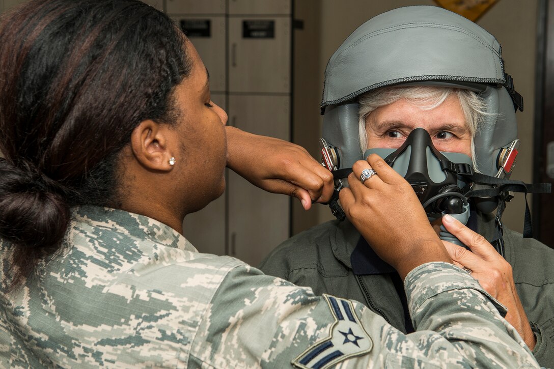 Mrs. Susan Mozena is fitted for an oxygen mask in preparation for a flight on a 93rd Bomb Squadron B-52H Stratofortress,  Sept. 21, 2018 at Barksdale Air Force Base, Louisiana. Mozena is the daughter Lt. Charles d’Olive, a World War I fighter ace who was assigned to the 93rd Aero Squadron in France. (U.S. Air Force photo by Master Sgt. Greg Steele)