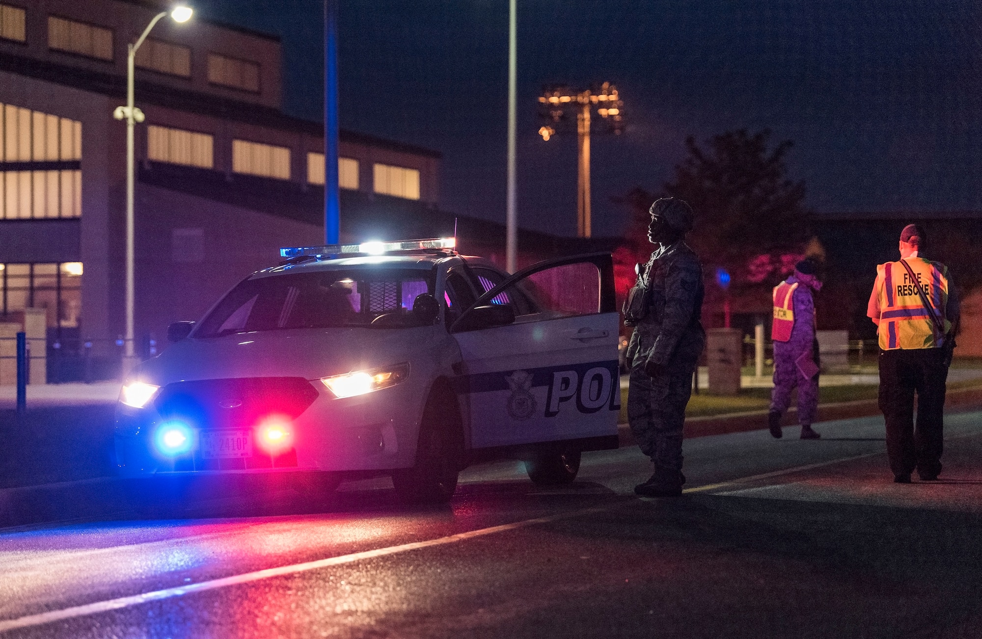 A 436th Security Forces Squadron response force member responds to a simulated bomb threat at the Command Post building Sept. 17, 2018, on Dover Air Force Base, Del. Wing Inspection Team members observed and evaluated the evacuation and actions taken by first responders. (U.S. Air Force photo by Roland Balik)