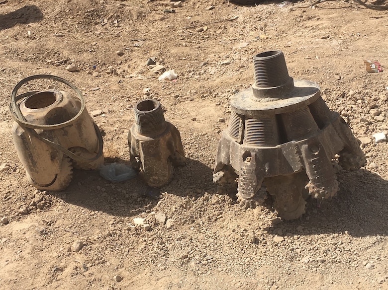 An assortment of the well drilling heads used in accomplishing the depth.