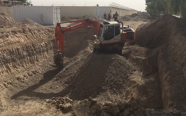 Contractors excavating a new sewage Lift Station for the Kandahar Air Wing Waste & Water treatment project.