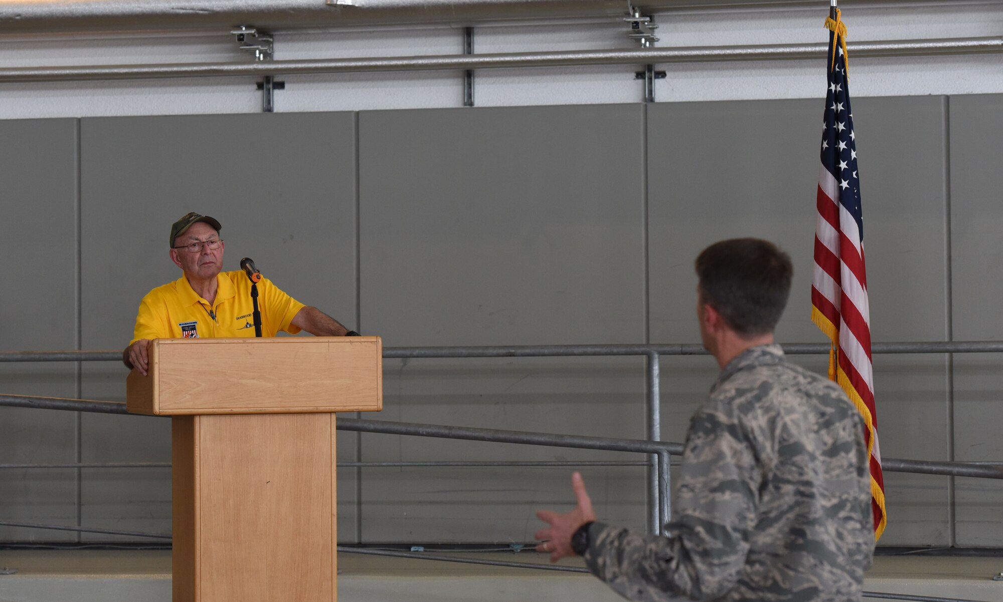 U.S. Air Force Col. Brad Spears, 521st Air Mobility Operations Wing commander, asks retired U.S. Air Force Maj. Joe Crecca a question about his experience as a prisoner or war during a speaking session on Ramstein Air Base, Germany, Sept. 17, 2018. After 75 successful combat missions, Crecca was shot down by enemy fire while flying his F-4 aircraft over North Vietnam. (U.S. Air Force photo by Airman 1st Class Kristoff Rixmann)