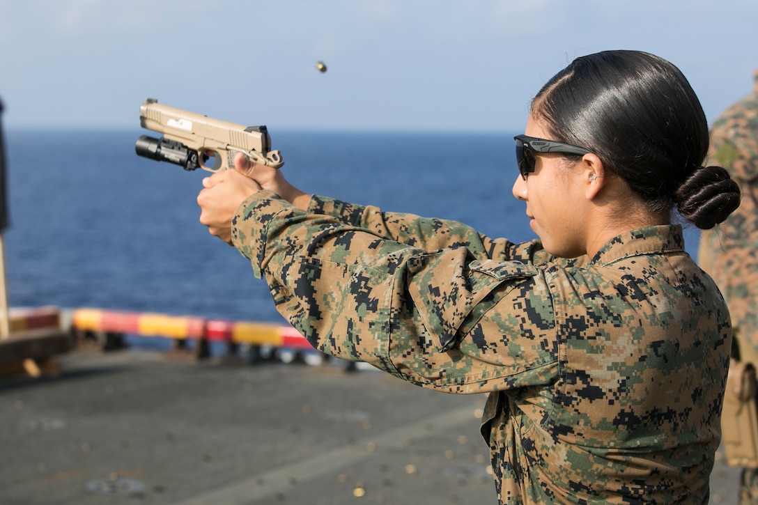 1st Lt. Samantha Rosales, a logistics planner with the 31st Marine Expeditionary Unit, fires an M1911 .45-caliber pistol during marksmanship training aboard the amphibious assault ship USS Wasp (LHD 1) while underway in the East China Sea, Sep. 21, 2018. Rosales, a native of San Clemente, California, graduated San Clemente High School June 2011; she commissioned June 2016. The Amphibious Reconnaissance Platoon Marines carry a variety of tactical weapons, including the M1911, and specialize in close-quarters battle tactics during amphibious operations.  The 31st MEU, the Marine Corps’ only continuously forward-deployed MEU, provides a flexible force ready to perform a wide-range of military operations in the Indo-Pacific region.