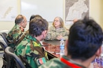 Navy Capt. Cynthia Gantt, commander of the NATO Role III Multinational Medical Unit, talks to the Kandahar Regional Military Hospital commander at the Role III in Kandahar Airfield, Afghanistan, Sept. 17, 2018. Medical officers from Role III and KRMH conduct routine case studies and medical training. Army photo by Staff Sgt. Neysa Canfield