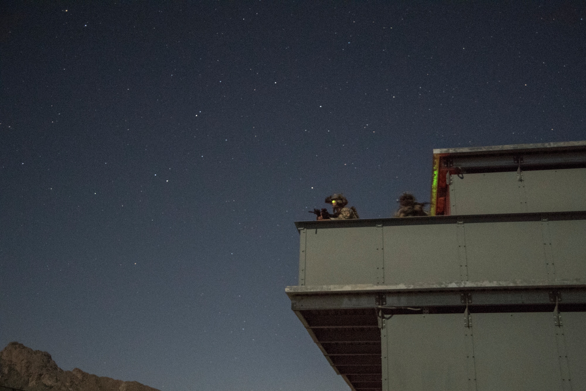 Special Tactics Airmen with the 21st Special Tactics Squadron scan the horizon following infiltrating a compound at Fort Bliss, Texas, June 23, 2018.