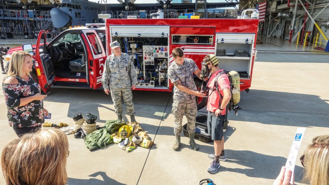 People learn about equipment at an air base.