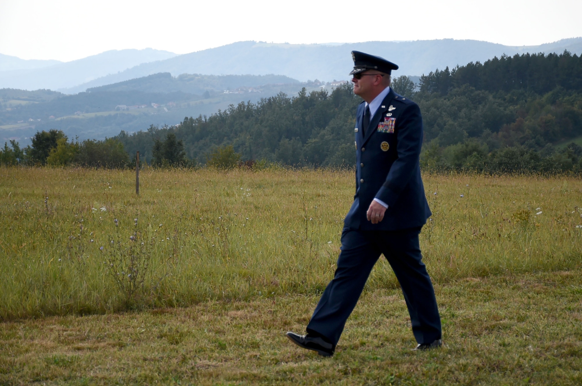Brig. Gen. Richard G. Moore Jr., U.S. Air Forces in Europe Chief of Staff, walks through a field outside of Pranjani, Serbia, on Sept. 22nd, 2018, during the 74th Halyard Mission Commemoration. Fields like this were used from Aug 1944 to Feb 1945, with the help of the Serbian population and the Yugoslav Armed Forces in the Homeland, to transport more than 500 U.S. and allied airmen from improvised runways in Serbia and Bosnia and Herzegovina to U.S. airbases in Italy. (U.S. Air Force photo by TSgt Stephen Ocenosak)