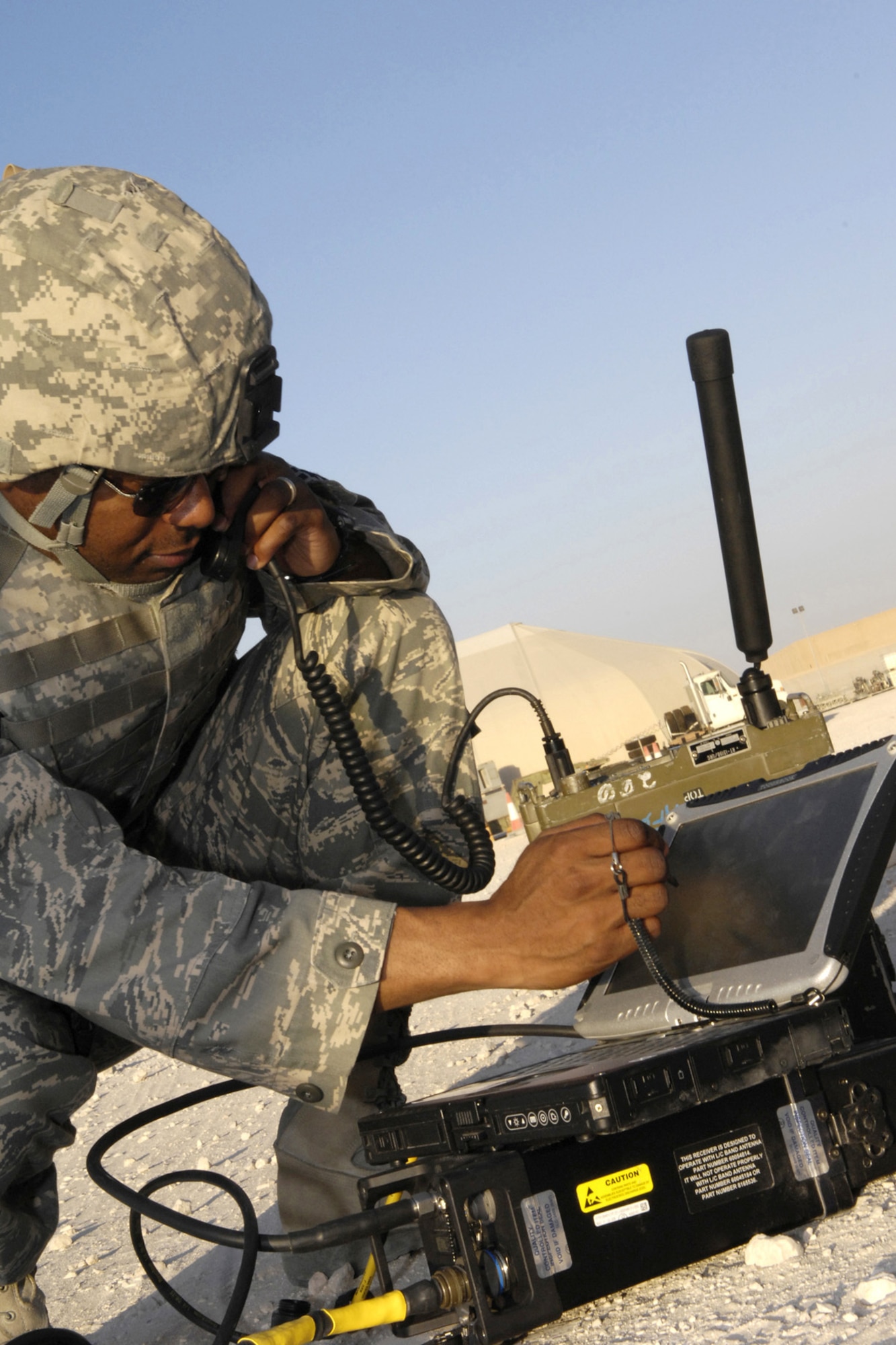 Master Sgt. Chris Thompson, chief joint terminal attack controller instructor at Fort Carson, Colo., deployed to the 704th Expeditionary Support Squadron at Al Udeid Air Base, Qatar, communicates via the remotely operated video enhanced receiver on Sept. 21, 2007.