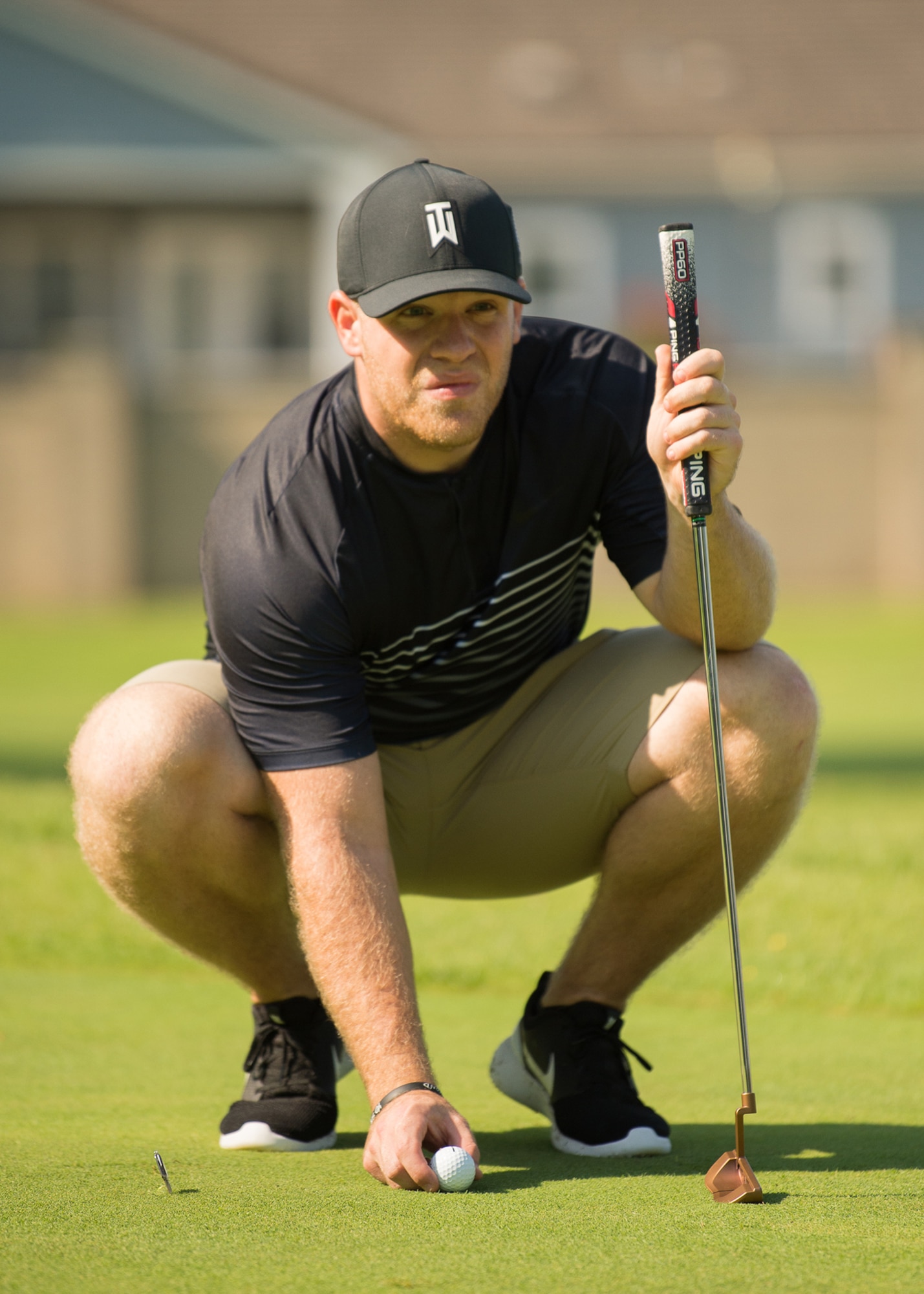 Tyler Kuhn, Dover Federal Credit Union, prepares for a putt at the Bluesuiters Golf Tournament Sept. 19, 2018, at Eagle Creek Golf Course on Dover Air Force Base, Del. The tournament is aimed at creating and maintaining good relations between Team Dover Airmen and the local community.