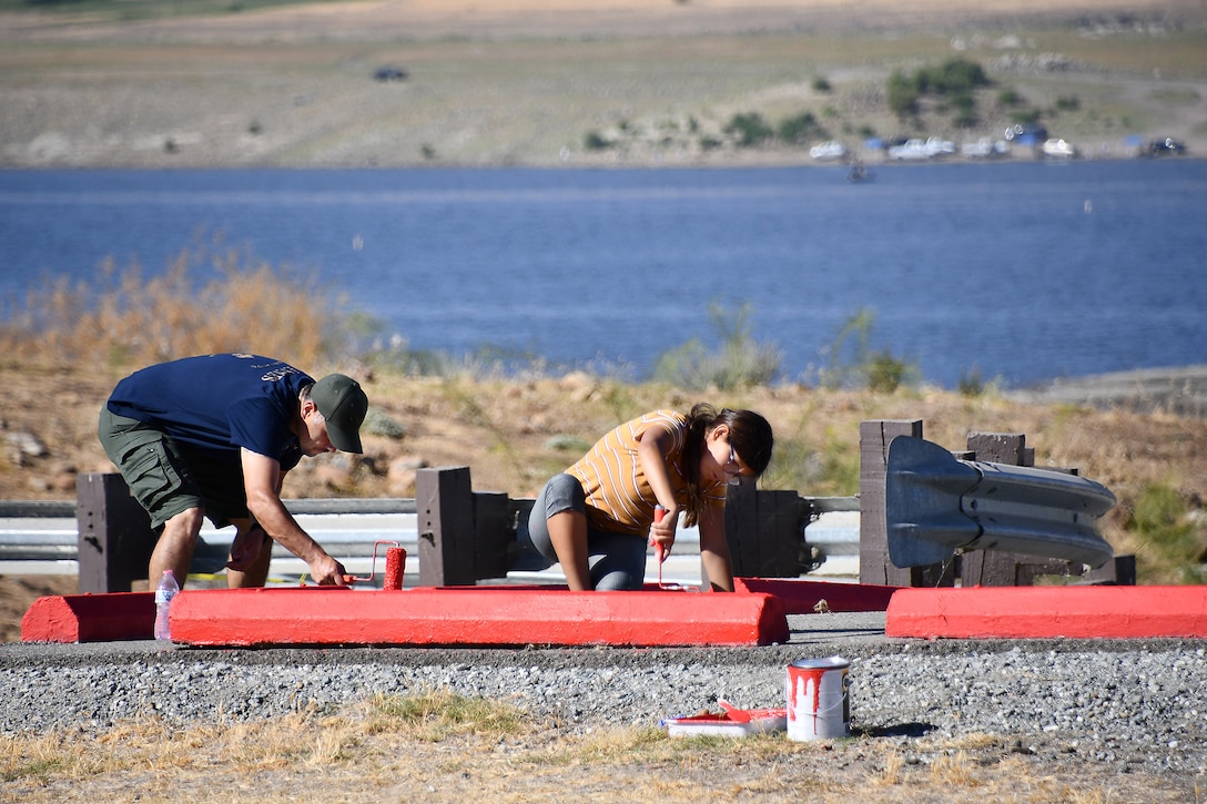 Volunteers paint curb stops during the National Public Lands Day event held at the U.S. Army Corps of Engineers Sacramento District's Success Lake on September 22, 2018.