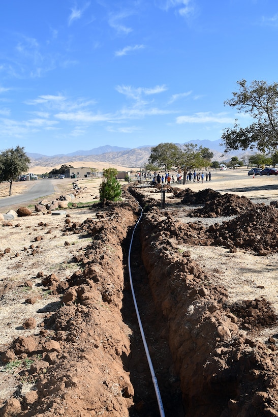 A group of volunteers do the hard work involved in spreading dirt at various locations throughout Success Lake during National Public Lands Day at the U.S. Army Corps of Engineers Sacramento District's Success Lake on September 22, 2018.