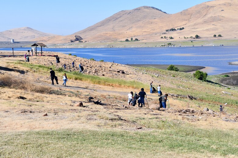 Volunteers fan out across a hillside to pick up trash during the National Public Lands Day event held at the U.S. Army Corps of Engineers Sacramento District's Success Lake on September 22, 2018.