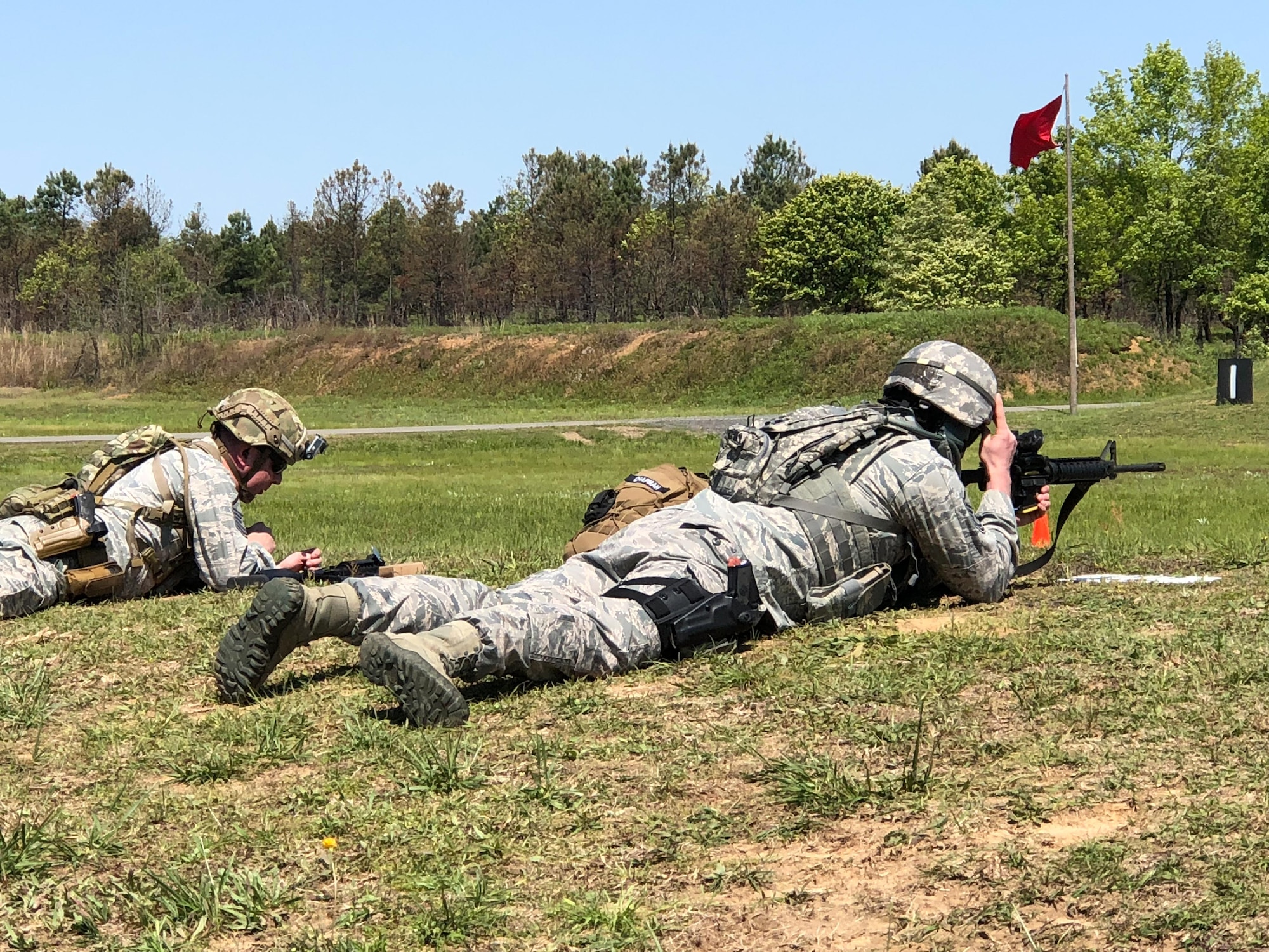 Master Sgt. Christopher Martin, left, 242nd Combat Communications Squadron first sergeant and team captain, and Master Sgt. Michael Chapman, 194th Security Forces Squadron, review the course of fire and practice sighting before the start of the 47th Annual Winston P. Wilson Championship, Robinson Maneuver Training Center, Arkansas, April 29, 2018.  The annual events, hosted by the National Guard Marksmanship Training Center April 29-May 4, 2018, offer Servicemembers from the National Guard and international community an opportunity to test marksmanship skills in a battle-focused environment. (U.S. Air National Guard photo by Staff Sgt. Hope Funderburk)