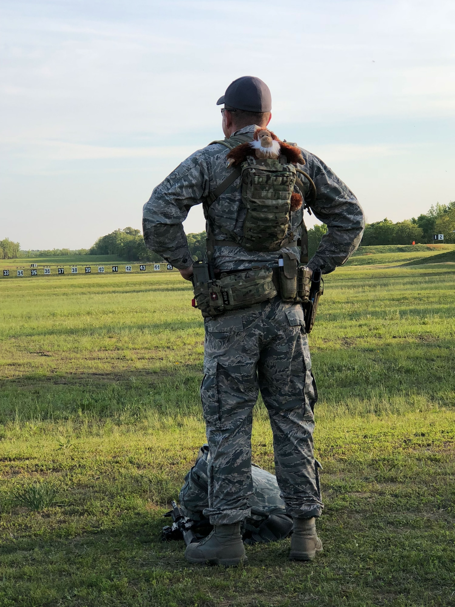 Master Sgt. Christopher Martin, 242nd Combat Communications Squadron first sergeant and team captain, enjoys an early morning sunrise with team mascot, Harry, prior to the start of the day at the  47th Annual Winston P. Wilson Championship, Robinson Maneuver Training Center, Arkansas, May 1, 2018.  The annual events, hosted by the National Guard Marksmanship Training Center April 29-May 4, 2018, offer Servicemembers from the National Guard and international community an opportunity to test marksmanship skills in a battle-focused environment. (U.S. Air National Guard photo by Staff Sgt. Hope Funderburk)