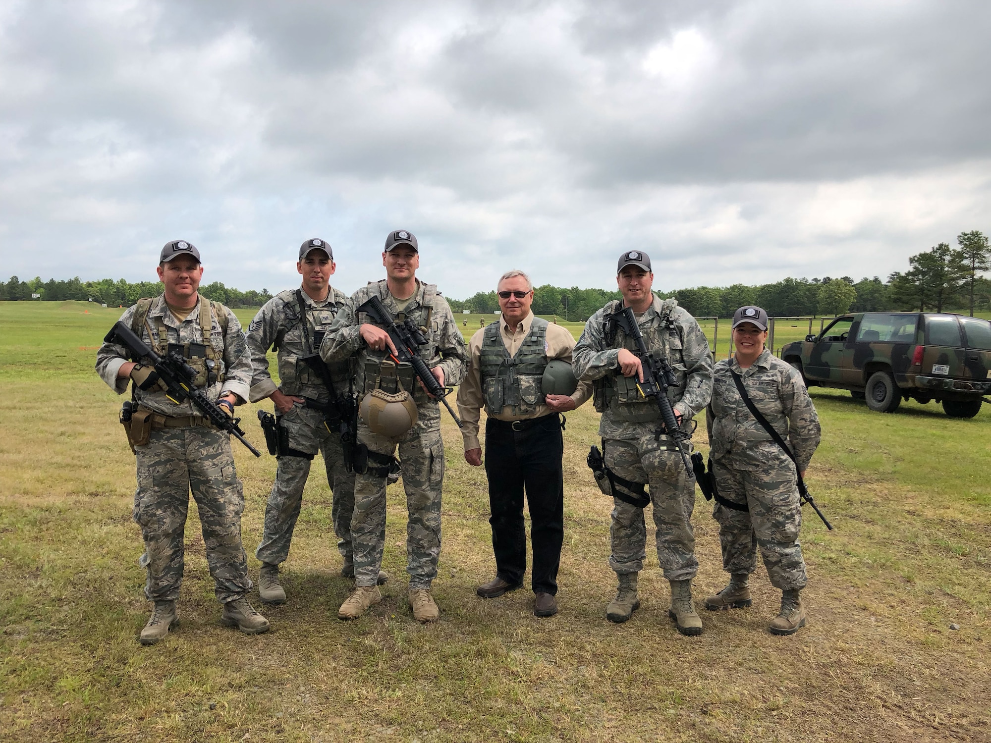 Master Sgt. Christopher Martin, left to right, 242nd Combat Communications Squadron first sergeant and team captain, Staff Sgt. Caleb Gutting, 141st Security Forces Squadron, Maj. Eric Manewal, 194th Wing, Gen. Frank Glass, 28th Chief of National Guard Bureau, Master Sgt. Michael Chapman, 194th Security Forces Squadron, and Staff Sgt. Hope Funderburk, 225th Support Squadron, pose for team picture during the  47th Annual Winston P. Wilson Championship, Robinson Maneuver Training Center, Arkansas, May 2, 2018.  The annual events, hosted by the National Guard Marksmanship Training Center April 29-May 4, 2018, offer Servicemembers from the National Guard and international community an opportunity to test marksmanship skills in a battle-focused environment. (U.S. Air National Guard photo by Staff Sgt. Hope Funderburk)