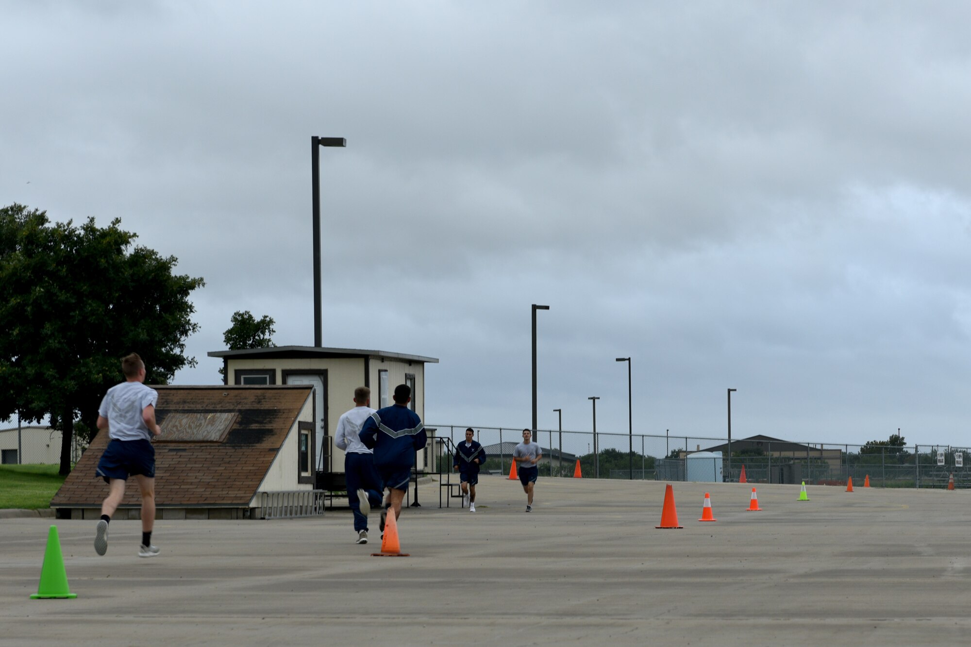 Participants run the final stretch of the Blood, Sweat and Stairs competition at the Louis F. Garland Department of Defense Fire Academy on Goodfellow Air Force Base, Texas, Sept. 22, 2018. The purpose of the event is to remind participants of the sacrifices of the emergency responders on September 11, 2001. (U.S. Air Force photo by Senior Airman Randall Moose/Released)
