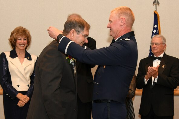 Bob Stevenson, Mayor of Layton City, Utah, receives the Hill Air Force Base Community Wingman Award from Col. Jon Eberlan, 75th Air Base Wing commander, at Hill's Air Force Ball Sept. 22. The annual honor recognizes a community member who has made a significant service contribution to the installation. (U.S. Air Force photo by Cynthia Griggs)