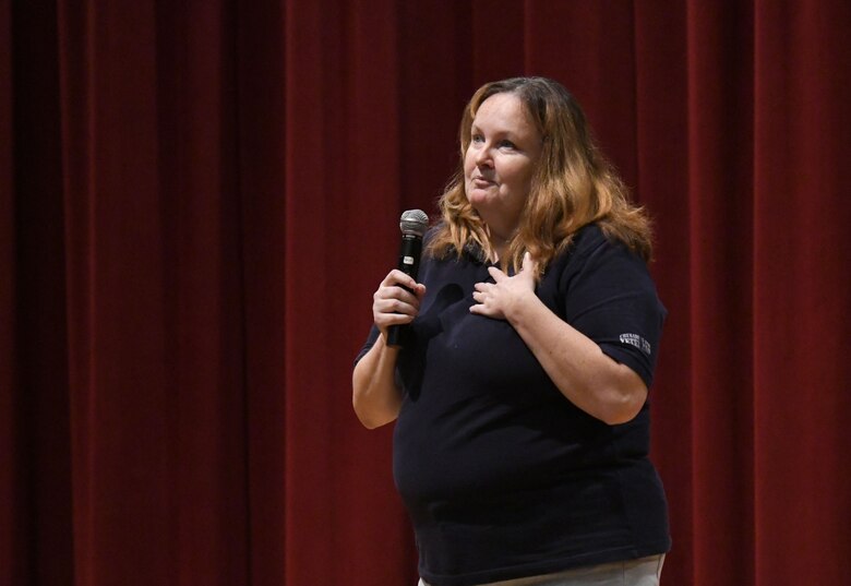 Retired U.S. Navy corpsman Tammy Washburn speaks during a 'Profiles in Courage' story-telling event at the Welch Theater at Keesler Air Force Base, Mississippi, Sept. 20, 2018. In recognition of suicide prevention and awareness month, military members shared their stories of bravery, strength and overcoming adversity with Keesler personnel. (U.S. Air Force photo by Kemberly Groue)