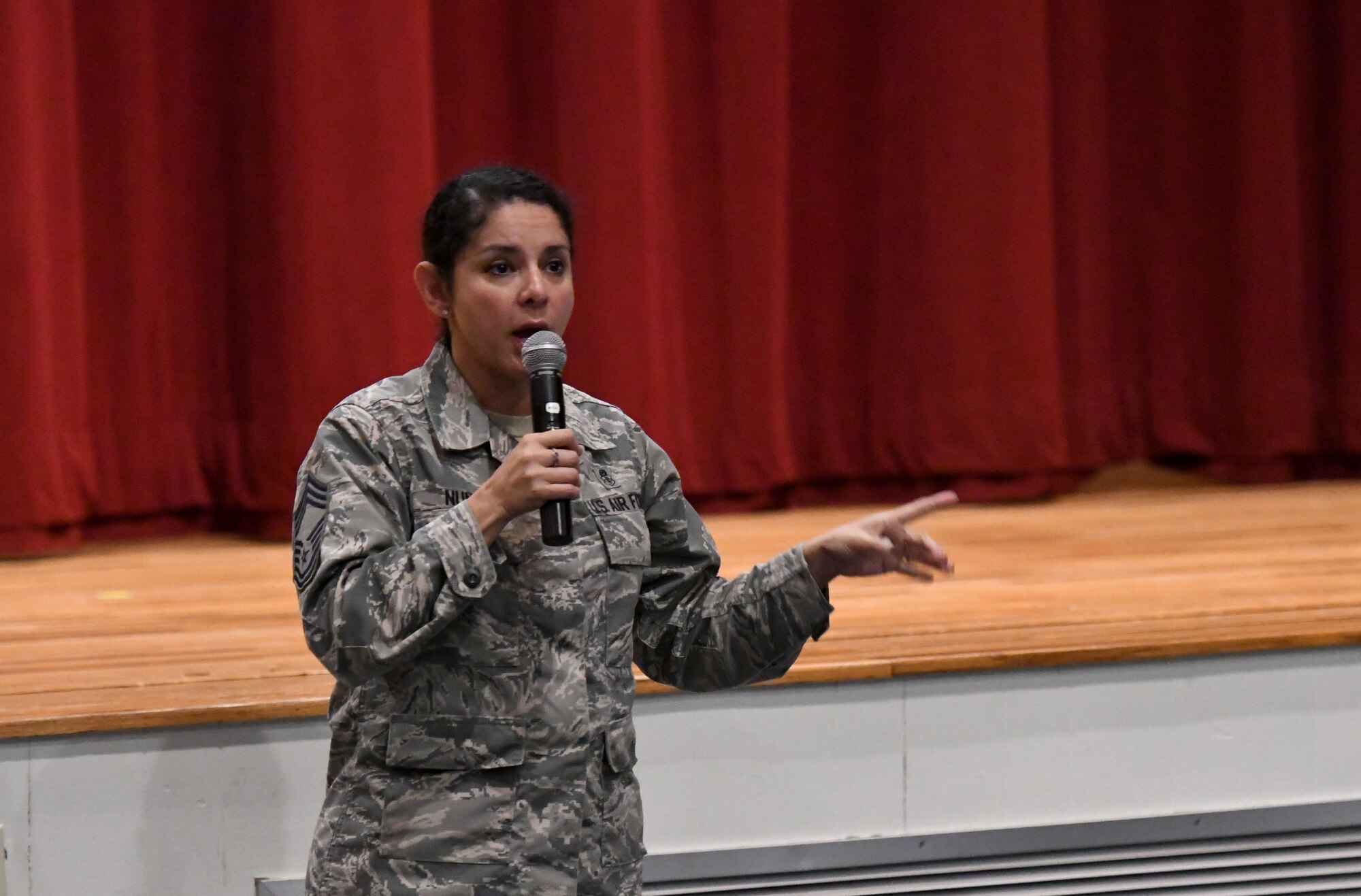 U.S. Air Force Chief Master Sgt. Sandra Nunes, 81st Medical Operations Squadron superintendent, speaks during a 'Profiles in Courage' story-telling event at the Welch Theater at Keesler Air Force Base, Mississippi, Sept. 20, 2018. In recognition of suicide prevention and awareness month, military members shared their stories of bravery, strength and overcoming adversity with Keesler personnel. (U.S. Air Force photo by Kemberly Groue)
