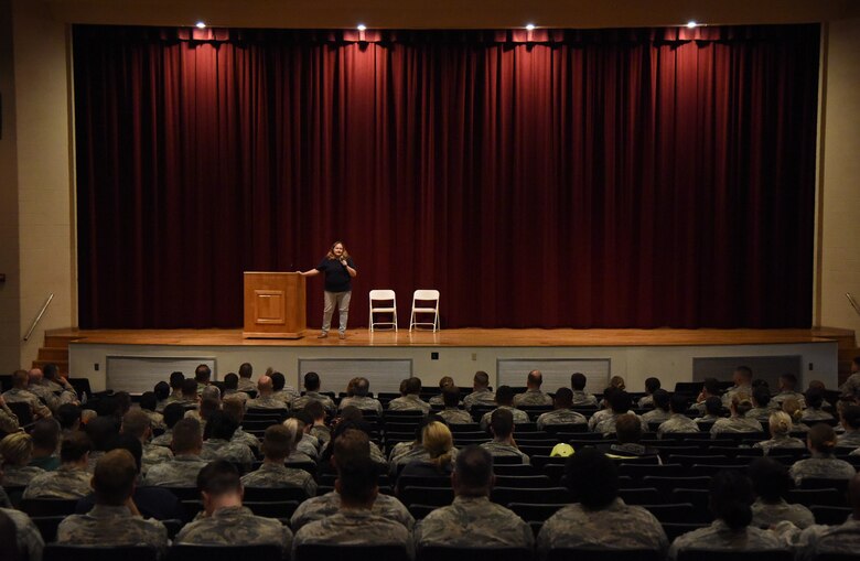 Retired U.S. Navy corpsman Tammy Washburn speaks during a 'Profiles in Courage' story-telling event at the Welch Theater at Keesler Air Force Base, Mississippi, Sept. 20, 2018. In recognition of suicide prevention and awareness month, military members shared their stories of bravery, strength and overcoming adversity with Keesler personnel. (U.S. Air Force photo by Kemberly Groue)