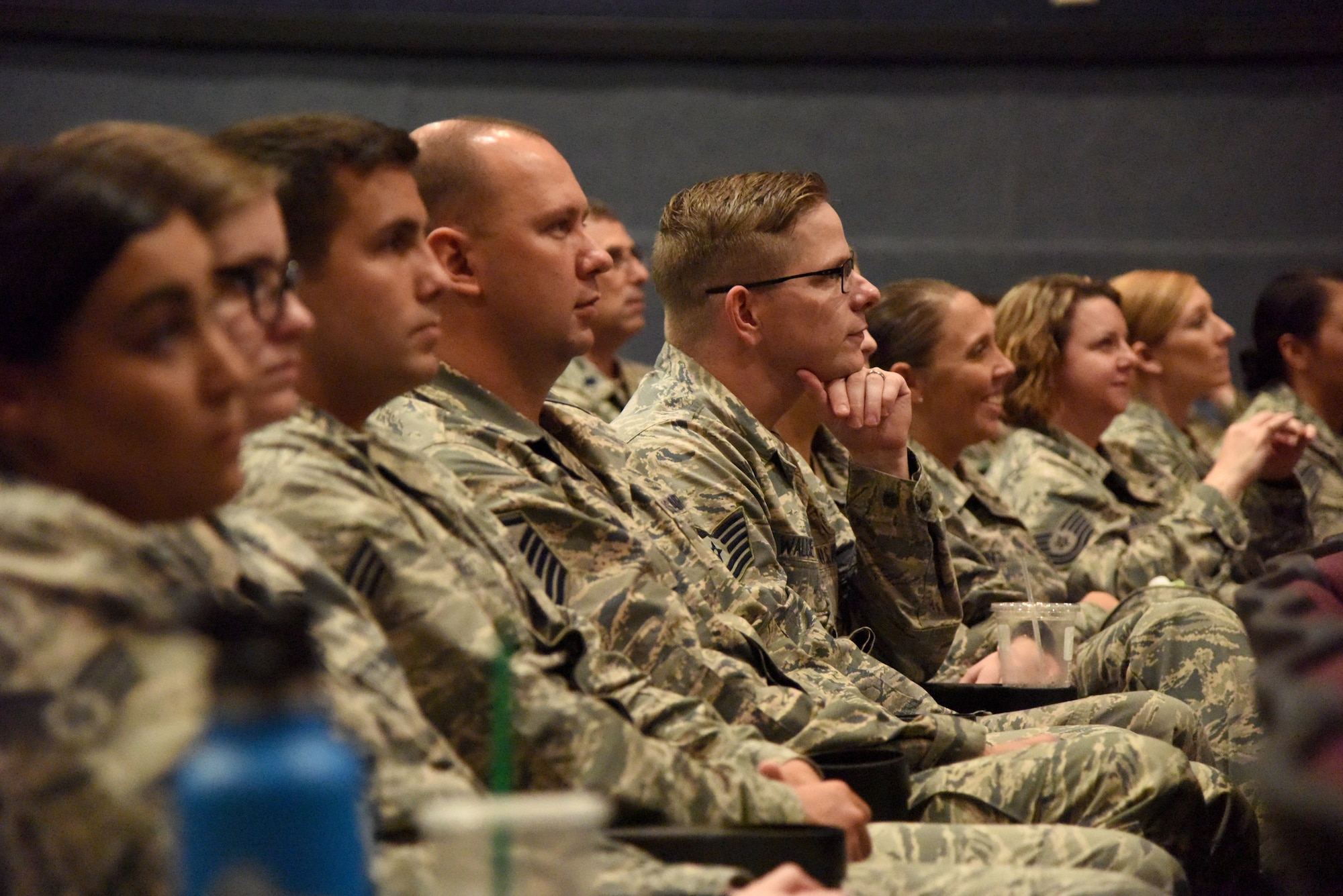 Keesler Airmen attend a 'Profiles in Courage' story-telling event at the Welch Theater at Keesler Air Force Base, Mississippi, Sept. 20, 2018. In recognition of suicide prevention and awareness month, military members shared their stories of bravery, strength and overcoming adversity with Keesler personnel. (U.S. Air Force photo by Kemberly Groue)