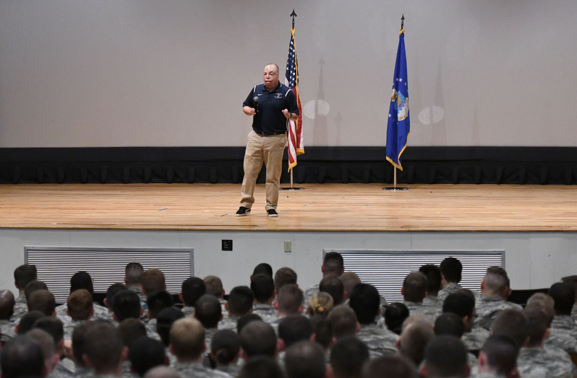 U.S. Air Force Senior Master Sgt. Israel Del Toro, 98th Flying Training Squadron accelerated freefall training program superintendent, U.S. Air Force Academy, Colorado, speaks to 81st Training Group Airmen at the Welch Theater at Keesler Air Force Base, Mississippi, Sept. 21, 2018. Del Toro was injured in Afghanistan on Dec. 4, 2005, and became the first 100 percent disabled Airman to reenlist in the Air Force on Feb. 8, 2010. (U.S. Air Force photo by Kemberly Groue)