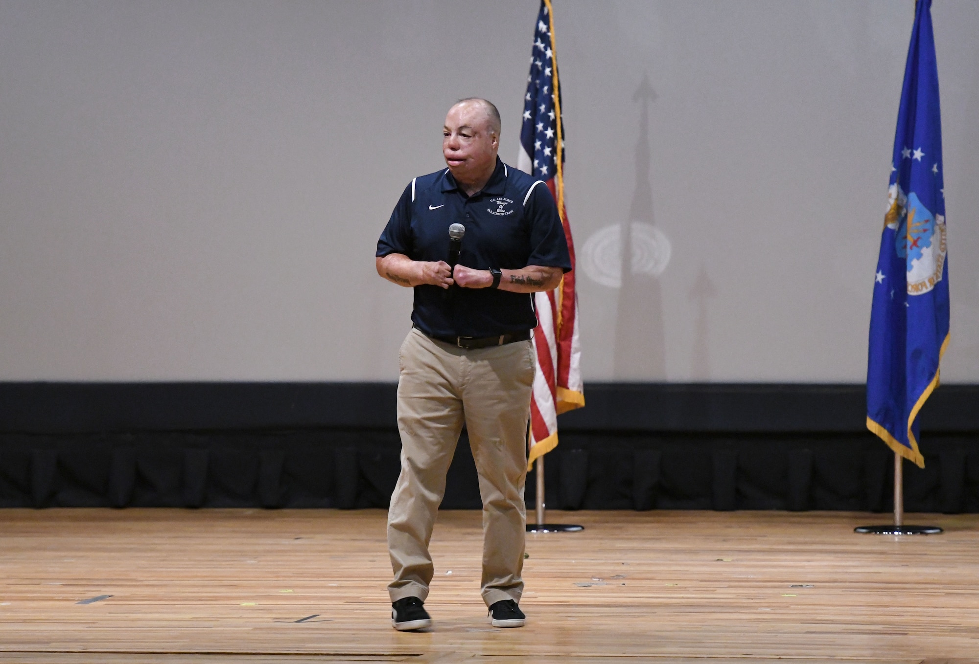U.S. Air Force Senior Master Sgt. Israel Del Toro, 98th Flying Training Squadron accelerated freefall training program superintendent, U.S. Air Force Academy, Colorado, speaks to 81st Training Group Airmen at the Welch Theater at Keesler Air Force Base, Mississippi, Sept. 21, 2018. Del Toro was injured in Afghanistan on Dec. 4, 2005, and became the first 100 percent disabled Airman to reenlist in the Air Force on Feb. 8, 2010. He also received the first field promotion in the Air Force. (U.S. Air Force photo by Kemberly Groue)