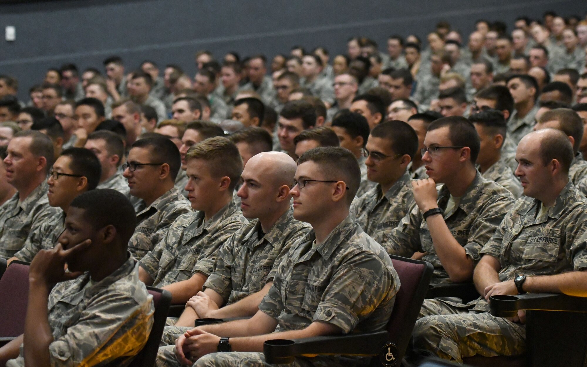 81st Training Group Airmen attend a speaking engagement by U.S. Air Force Senior Master Sgt. Israel Del Toro, 98th Flying Training Squadron accelerated freefall training program superintendent, U.S. Air Force Academy, Colorado, at the Welch Theater at Keesler Air Force Base, Mississippi, Sept. 21, 2018. Del Toro was injured in Afghanistan on Dec. 4, 2005, and became the first 100 percent disabled Airman to reenlist in the Air Force on Feb. 8, 2010. He also received the first field promotion in the Air Force. (U.S. Air Force photo by Kemberly Groue)