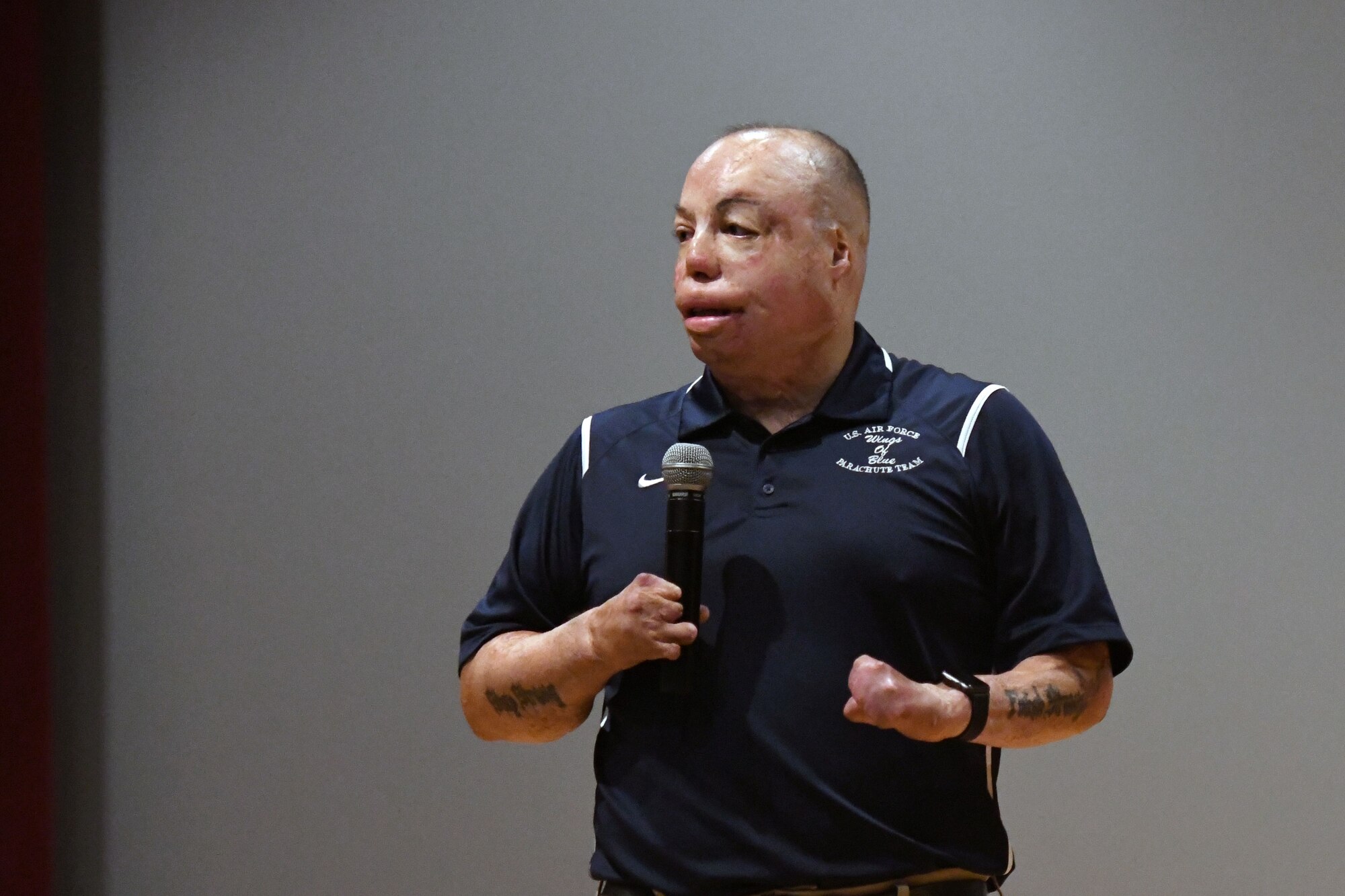 U.S. Air Force Senior Master Sgt. Israel Del Toro, 98th Flying Training Squadron accelerated freefall training program superintendent, U.S. Air Force Academy, Colorado, speaks to 81st Training Group Airmen at the Welch Theater at Keesler Air Force Base, Mississippi, Sept. 21, 2018. Del Toro was injured in Afghanistan on Dec. 4, 2005, and became the first 100 percent disabled Airman to reenlist in the Air Force on Feb. 8, 2010. (U.S. Air Force photo by Kemberly Groue)