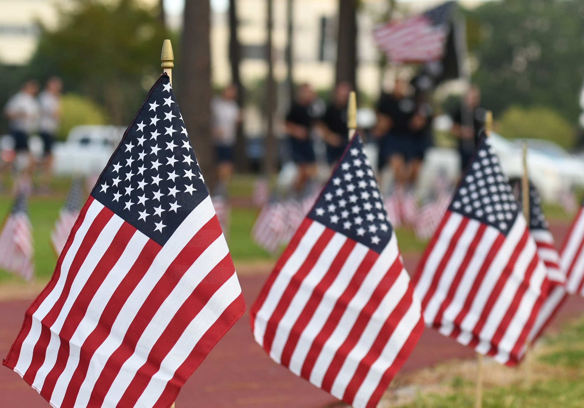 Members of the 81st Training Support Squadron participate in Keesler's POW/MIA 24-hour memorial run and vigil at the Crotwell Track at Keesler Air Force Base, Mississippi, Sept. 20, 2018. The event was held to raise awareness and pay tribute to all prisoners of war and those military members still missing in action. (U.S. Air Force photo by Kemberly Groue)