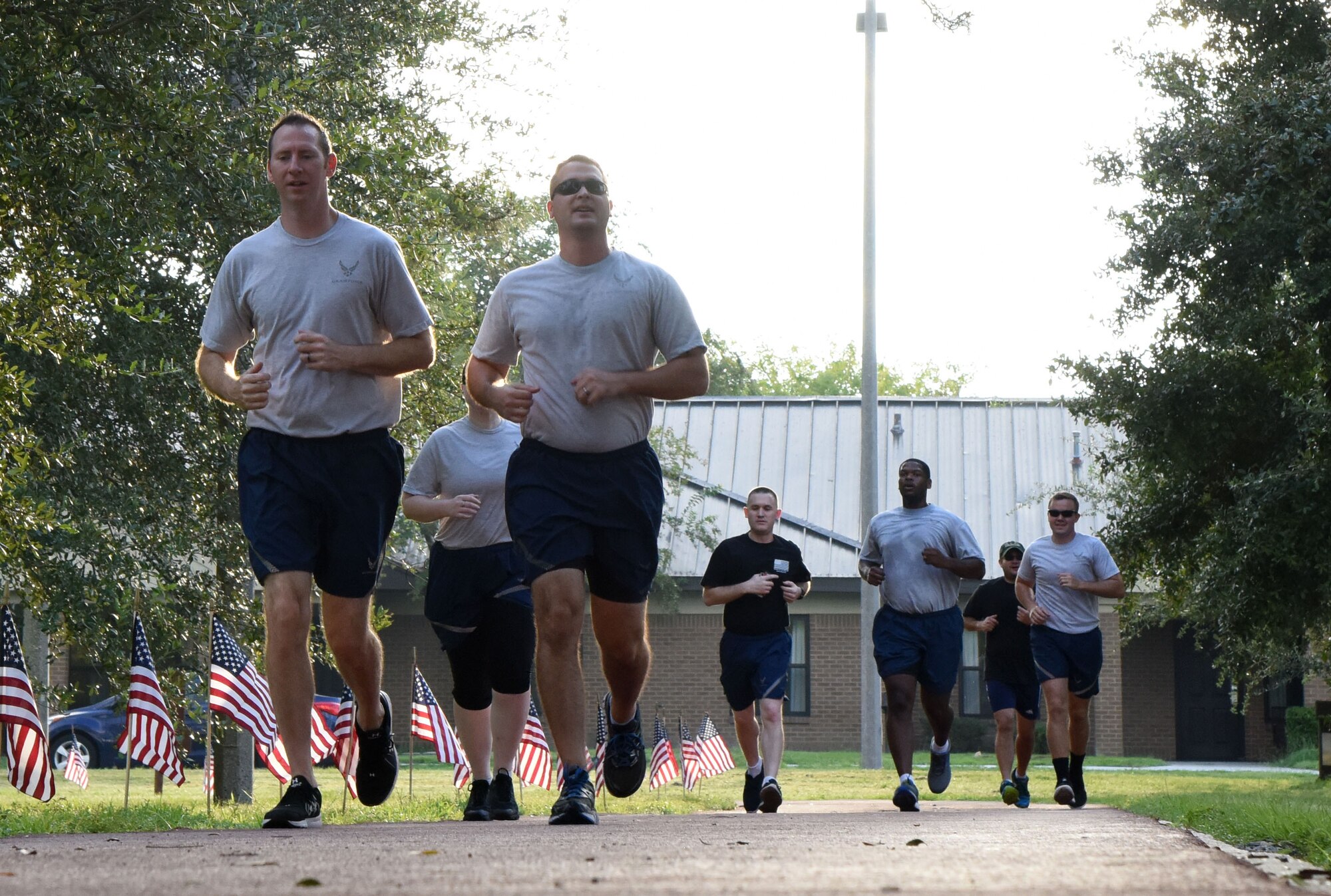 Members of the 81st Training Support Squadron participate in Keesler's POW/MIA 24-hour memorial run and vigil at the Crotwell Track at Keesler Air Force Base, Mississippi, Sept. 20, 2018. The event was held to raise awareness and pay tribute to all prisoners of war and those military members still missing in action. (U.S. Air Force photo by Kemberly Groue)