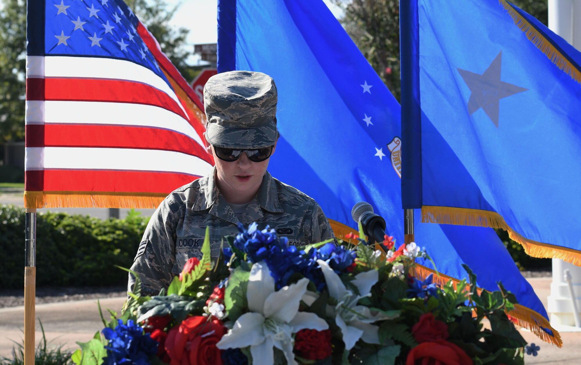 U.S. Air Force Senior Airman Holly Cook, 81st Training Wing photojournalist, delivers remarks during the POW/MIA Retreat Ceremony at Keesler Air Force Base, Mississippi, Sept. 20, 2018. The event was held to raise awareness and to pay tribute to all prisoners of war and those military members still missing in action. (U.S. Air Force photo by Kemberly Groue)