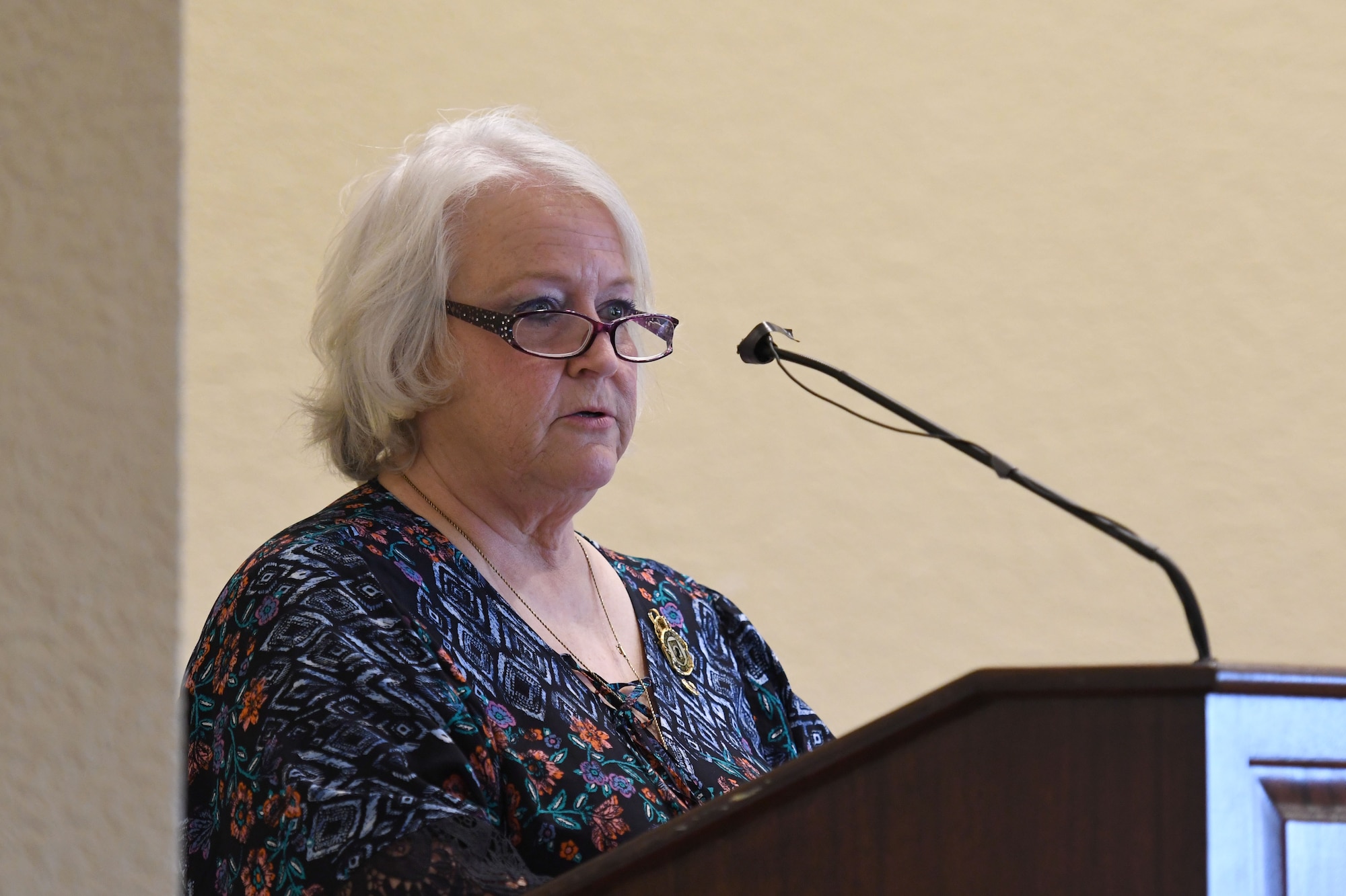 Diane Moore, daughter of U.S. Air Force Chief Master Sgt. Thomas Moore, POW/MIA Vietnam, delivers remarks during the POW/MIA Remembrance Luncheon at the Bay Breeze Event Center at Keesler Air Force Base, Mississippi, Sept. 21, 2018. The event, hosted by the Air Force Sergeants Association, was held to raise awareness and to pay tribute to all prisoners of war and those military members still missing in action. (U.S. Air Force photo by Kemberly Groue)