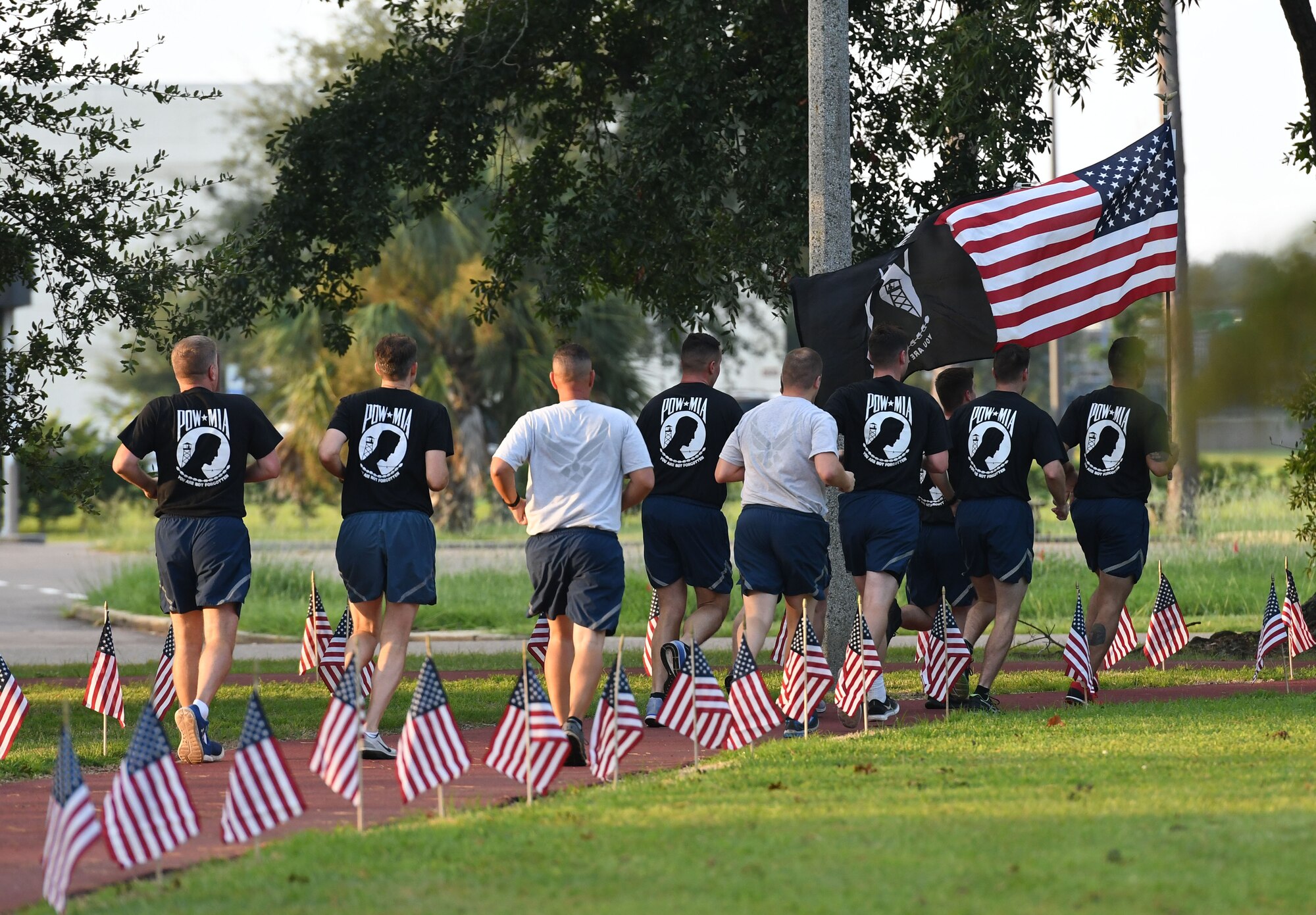 Members of the 81st Training Support Squadron participate in Keesler's POW/MIA 24-hour memorial run and vigil at the Crotwell Track at Keesler Air Force Base, Mississippi, Sept. 20, 2018. The event was held to raise awareness and pay tribute to all prisoners of war and those military members still missing in action. (U.S. Air Force photo by Kemberly Groue)