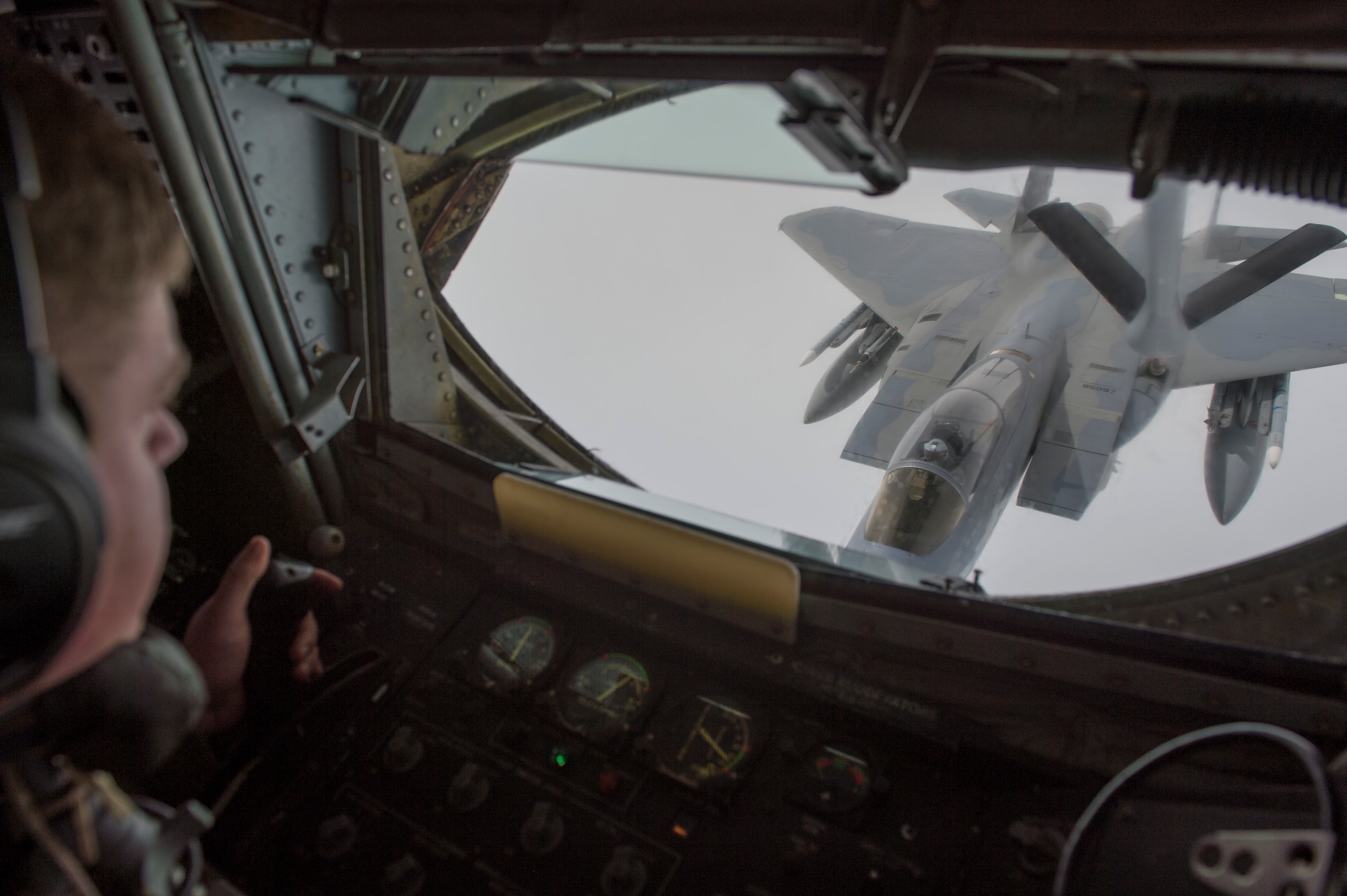 U.S. Air Force Technical Sargent Michael Voorhees, with 909th Air Refueling Squadron, refuels an F-15C in support of Valiant Shield, on Sept 20, 2018. Valiant Shield is a U.S. only, biennial field training exercise (FTX) with a focus on integration of joint training in a blue-water environment among U.S. forces. This training enables real-world proficiency in sustaining joint forces through detecting, locating, tracking, and engaging units at sea, in the air, on land, and in cyberspace in response to a range of mission areas. (U.S. Navy photo Mass Communication Specialist 3rd Class Darienne Slack)