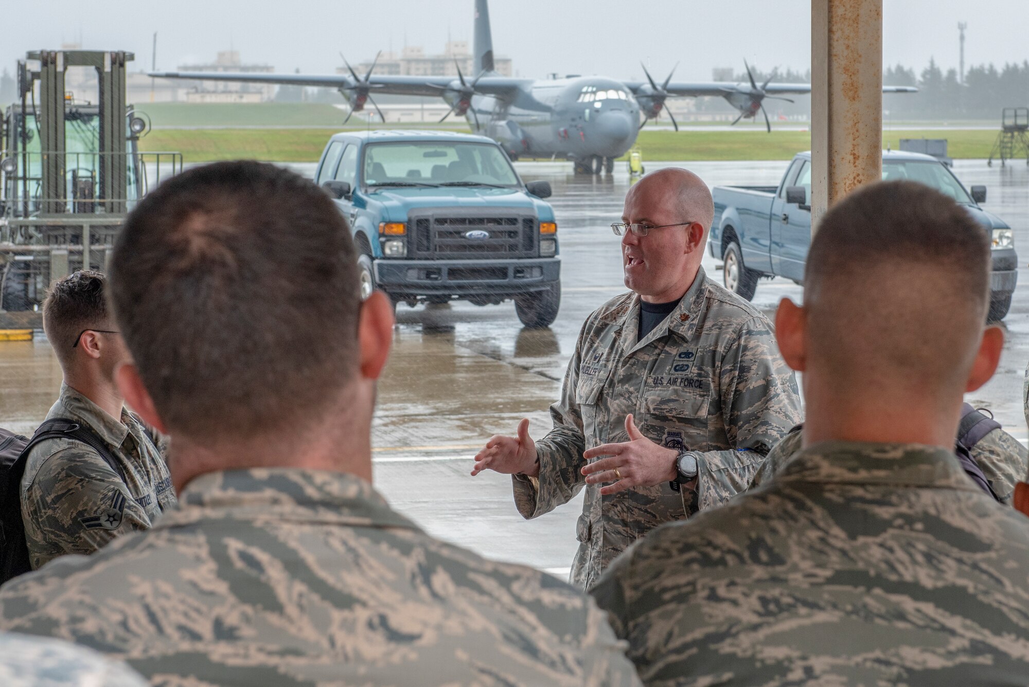 Maj. David Mueller, 374th Aircraft Maintenance Squadron commander, speaks with the Airmen of the 374 AMXS about the importance of looking out for one another during Suicide Prevention Awareness Month at Yokota Air Base, Japan, Sept. 21, 2018.