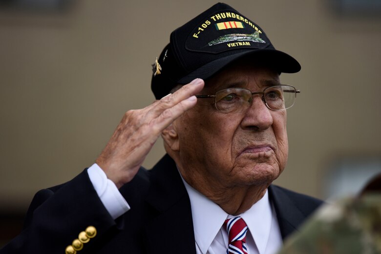 Retired Air Force Col. Murphy Neal Jones, Vietnam War veteran, salutes during the national anthem at a POW/MIA retreat ceremony Sept. 21, 2018, at Dover Air Force Base, Del. Jones spent more than six years as a POW during the Vietnam War and was repatriated in February 1973. (U.S. Air Force photo by Airman 1st Class Zoe M. Wockenfuss)