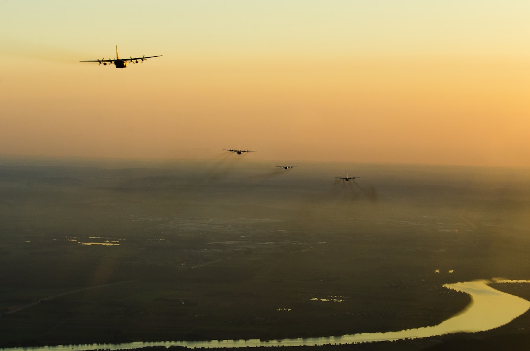 U.S. Air Force C-130 Hercules aircraft from various Air National Guard and Air Force Reserve units, as well as allied nations, participate in a personnel drop during Saber Junction 18 above Germany, Sept. 19, 2018. Saber Junction 18 is the U.S. Army 173rd Airborne Brigade’s combat training center certification exercise, taking place on the Grafenwoehr and Hohenfels training areas. The U.S. Army Europe-directed exercise is designed to assess the readiness of the brigade to conduct unified land operations in a joint, combined environment and to promote interoperability with participating allies and partner nations. Saber Junction 18 includes nearly 5,500 participants from 20 ally and partner nations. (U.S. Air National Guard photo by Staff Sgt. Patrick Evenson)