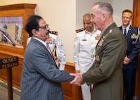 Chairman of the Joint Chiefs of Staff Gen. Joseph F. Dunford, Jr. greets Bahraini Minister for Defense Affairs Lt. Gen. Yusuf bin Ahmad bin Husayn al-Jalahma at the Pentagon in Washington D.C., Sept. 24, 2018