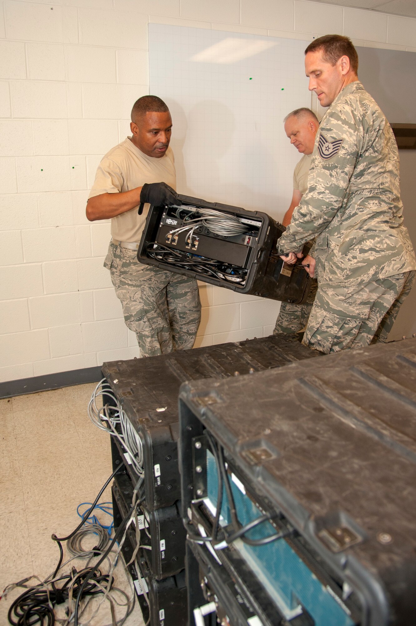 Airmen perform operational checks on equipment.