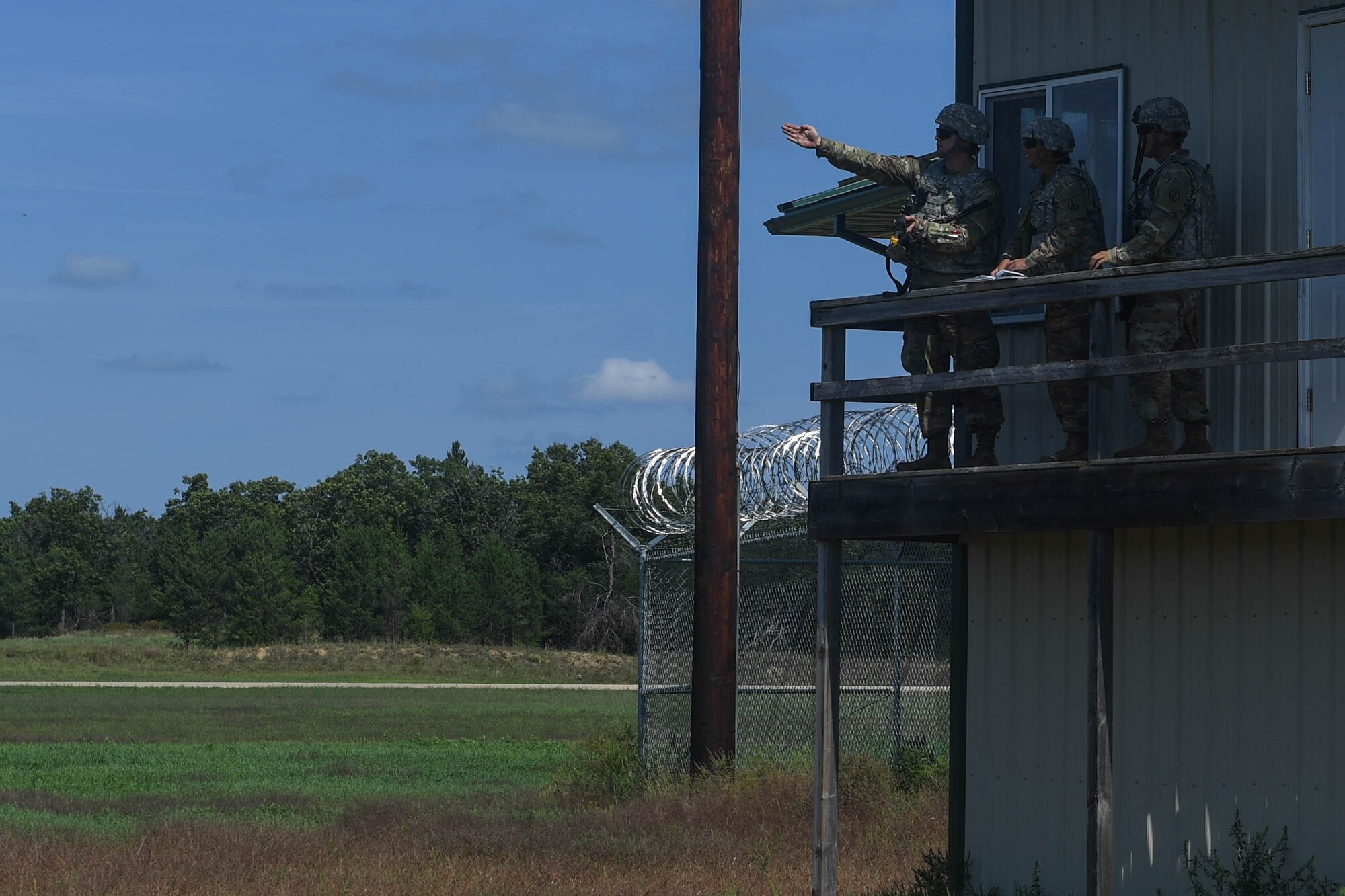 U.S. Army Soldiers assigned to the 689th Rapid Port Opening Element, 832nd Transportation Battalion, 597th Transportation Brigade survey potential locations for a cargo yard during Exercise Turbo Distribution 18-02 at Fort McCoy, Wisconsin, Sept. 9, 2018. The 689th RPOE was responsible for ensuring the cargo yard operations were running efficiently and pushing cargo out to their customers or camps. (U.S. Air Force photo by Senior Airman Derek Seifert)