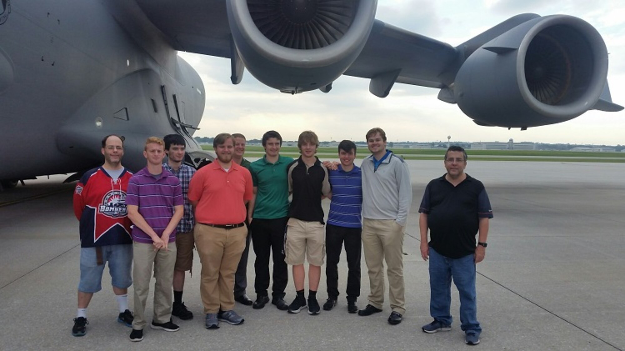 Members of the Wright State University hockey team and their assistant athletic director stand in front of a C-17 they toured on the first leg of their team-building tour of Wright-Patterson Air Force Base Sep. 6. (U.S. Air Force photo/W. Eugene Barnett)