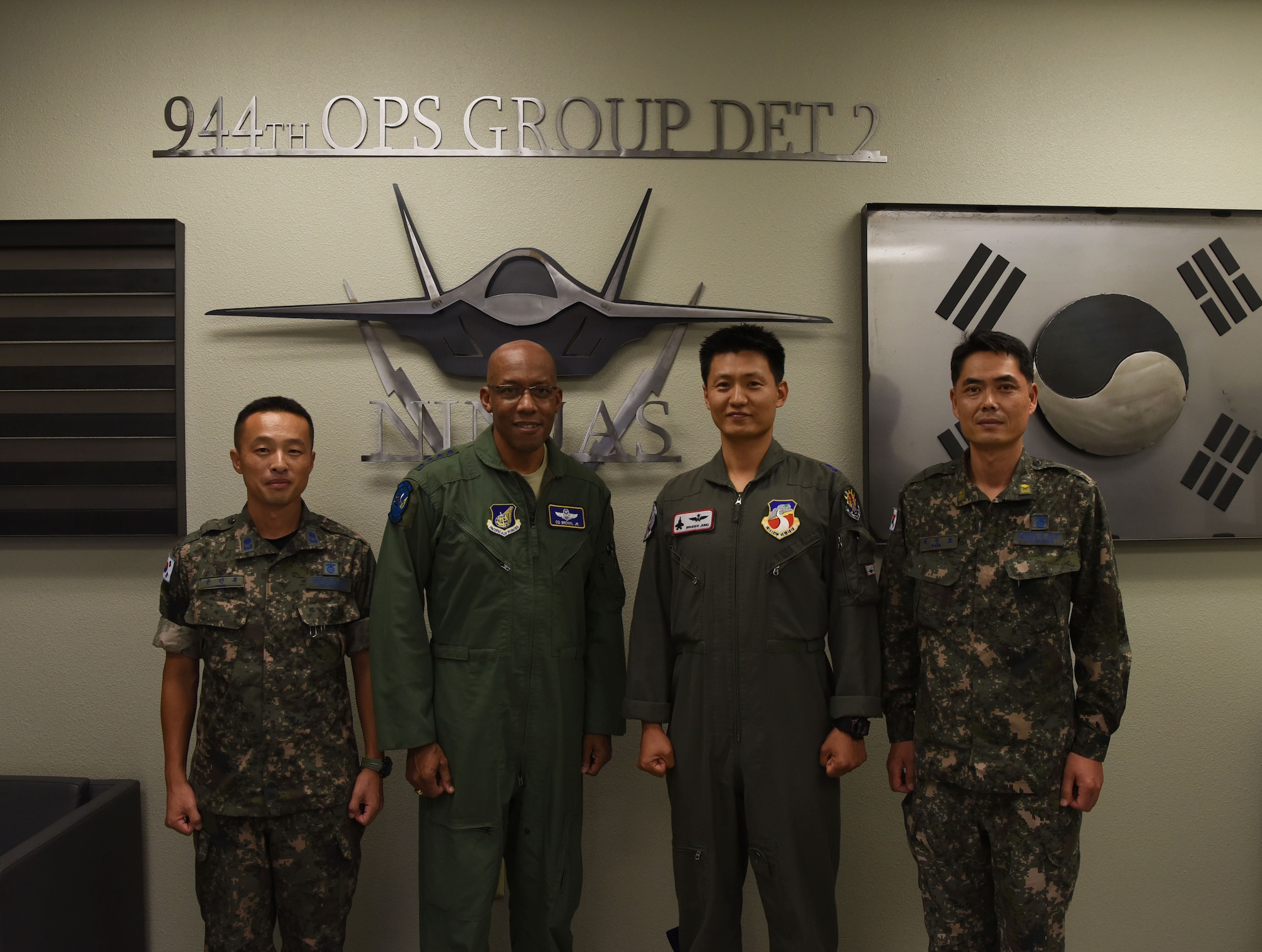 Gen. CQ Brown Jr., Pacific Air Forces commander poses with Republic of Korea Air Force members for a photo during his visit to Luke Air Force Base, Ariz., Sept. 20, 2018.