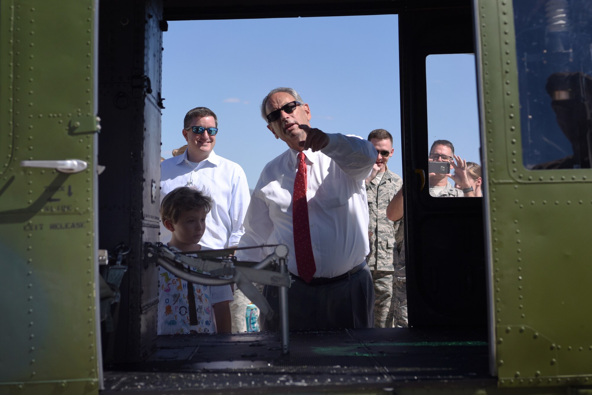 Airmen of the 377th Medical Group and members of the local healthcare community tour a UH-1N Huey assigned to the 58th Special Operations Wing during a community partner open house at Kirtland Air Force Base, N.M., Sept. 24, 2018. The local healthcare provides specialty care to Airmen and their families if the 377th MDG cannot. (U.S. Air Force photo by Senior Airman Eli Chevalier)