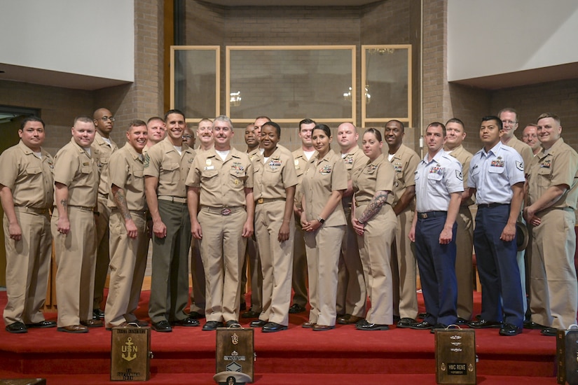 The selectees of the chief induction program pose for a group photo Sept. 21, 2018, at the All Saints Chapel at Joint Base Charleston, S.C. The program is used to indoctrinate Sailors into the highest tier of its enlisted force. This class specifically offered the opportunity for Airmen and Marines to participate as well.