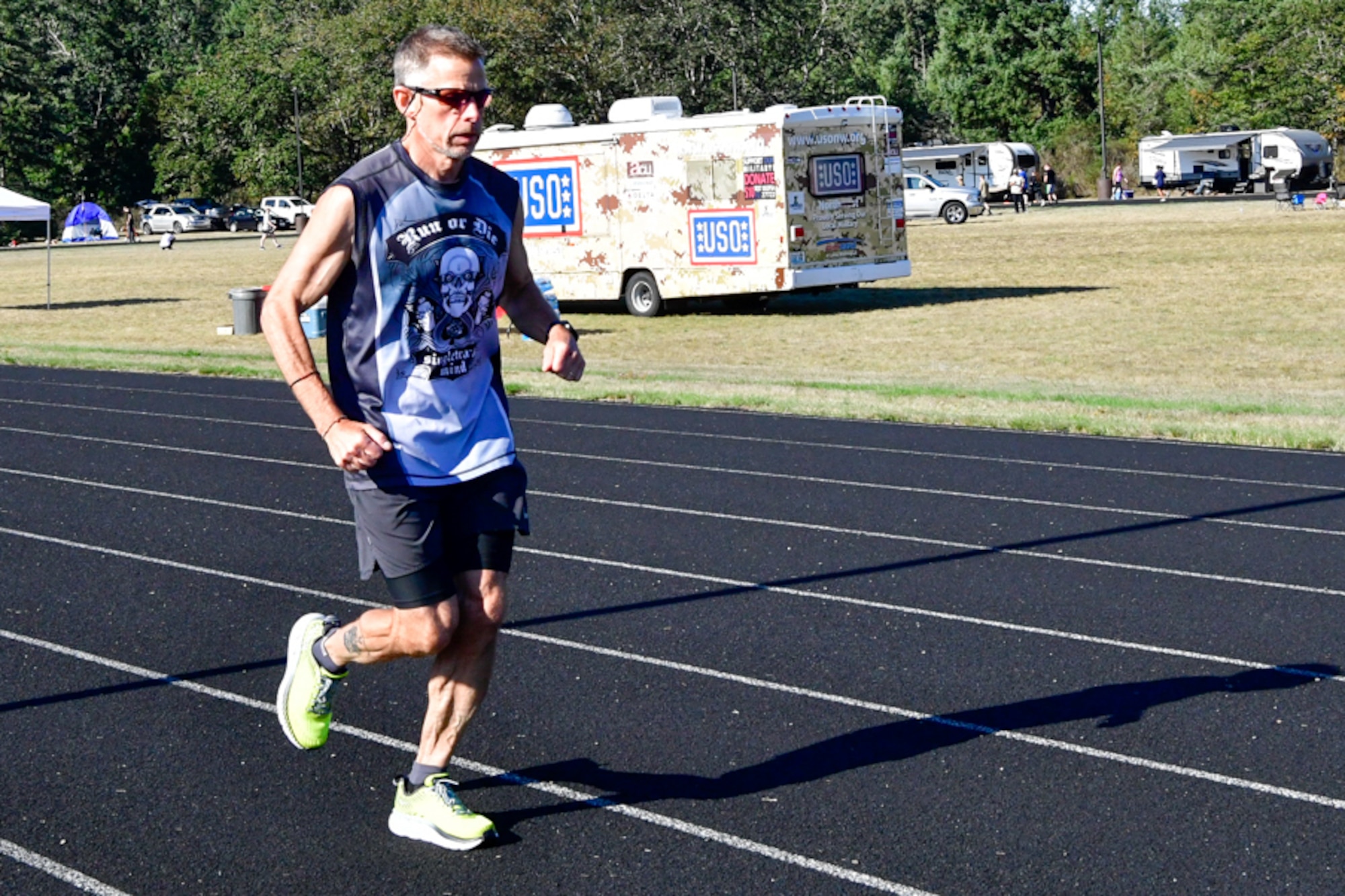 Bruce Robie, 225th Support Squadron National Airspace System Defense program manager, pushes through the mental and physical wall on mile 73 during the Joint Base Lewis-McChord 24-Hour POW/MIA Remembrance Run Sept. 19, 2018. Robie finished second in the individual standings with 74 miles. (U.S. Air National Guard photo by Maj. Kimberly Burke)