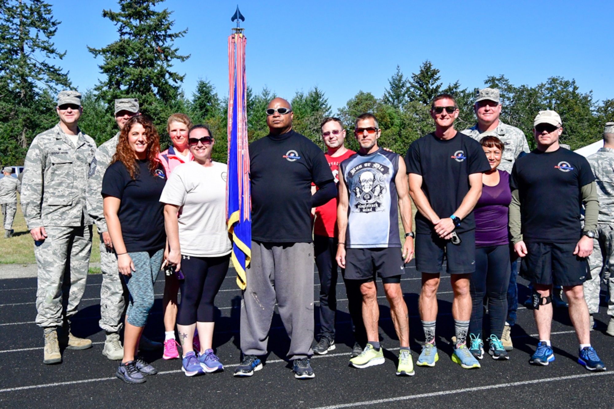 Members of the Western Air Defense Sector pose of a team photo after completing the 24-Hour POW/MIA Remembrance Run at the McChord Field track Sept. 19, 2018.  The WADS team completed 389 miles and place third in the overall team standings.  1st Lt. Kroby Keller place first in the individual standings with 100 miles and Bruce Robie placed second in the individual standings with 74 miles. (U.S. Air National Guard photo by Maj. Kimberly Burke)