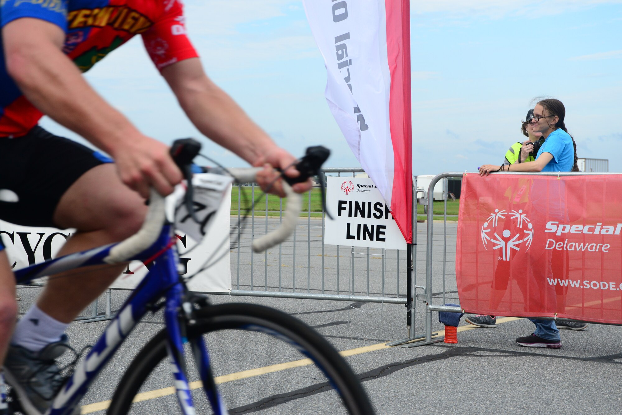 An athlete crosses the finish line for the 15K portion of the 2018 Special Olympics Delaware competition Sept. 22, 2018, at Dover Air Force Base, Del. During the event, contestants competed in seven different race categories, including 500M, 5K and 20K distances. (U.S. Air Force Photo by Airman First Class Dedan D. Dials)