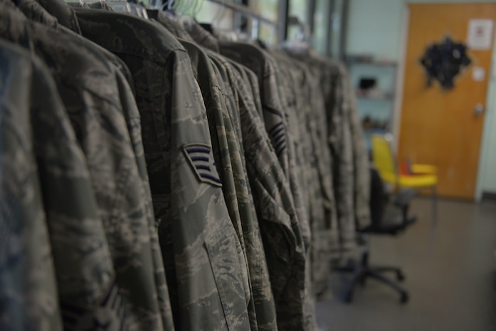 Air Force uniforms hang in the base resale shop's uniform section at Joint Base Charleston, S.C. Sept. 4, 2018. The base recently converted the old consignment shop into a resale shop for the community to buy and donate quality used clothing and supplies.